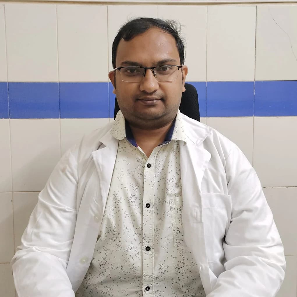 Dr. Bineet Panigrahi helping a child during consultation